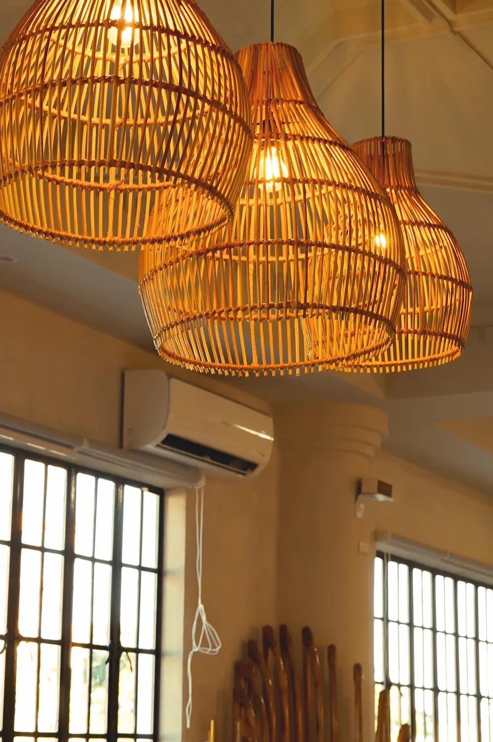 Dimly-lit wooden lamps hanging from the ceiling