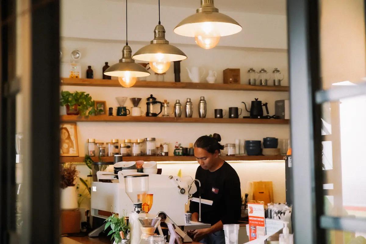 A barista in the process of making coffee